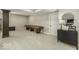 Spacious carpeted basement with shuffleboard table, media cabinet, and neutral decor at 7648 Killarney Dr, Indianapolis, IN 46217