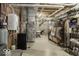 Unfinished basement with exposed ductwork, shelving, and mechanical equipment, ready for customization at 7648 Killarney Dr, Indianapolis, IN 46217