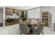 Basement kitchenette with a unique wood table and seating and a decorative display case at 7648 Killarney Dr, Indianapolis, IN 46217