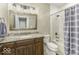 Well-lit bathroom with a decorative vanity, large mirror, and a shower/tub combo at 7648 Killarney Dr, Indianapolis, IN 46217