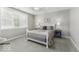 Cozy bedroom with natural light, comfortable bed, bedside lamps, and carpet at 7648 Killarney Dr, Indianapolis, IN 46217