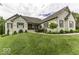 Charming brick home with manicured lawn and landscaping, complemented by stylish shutters at 7648 Killarney Dr, Indianapolis, IN 46217