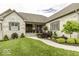 Beautiful brick home with landscaped front yard and welcoming walkway leading to the entrance at 7648 Killarney Dr, Indianapolis, IN 46217