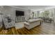 Spacious living room with hardwood floors, modern decor, and a dining area, great for gatherings at 7648 Killarney Dr, Indianapolis, IN 46217
