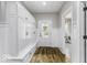 Well-organized mudroom features built-in storage cabinets, bench seating, and an exterior door at 7648 Killarney Dr, Indianapolis, IN 46217
