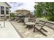 Relaxing poolside patio with comfortable seating, umbrellas, and scenic backyard views at 7648 Killarney Dr, Indianapolis, IN 46217