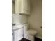 Cozy bathroom featuring a pedestal sink, toilet, and tiled floor at 7824 Hearthstone Way, Indianapolis, IN 46227