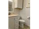 Bathroom featuring a vanity, toilet, tile floors, and white walls at 7824 Hearthstone Way, Indianapolis, IN 46227