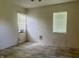Bedroom with two windows and plank floor and an AC window unit at 7824 Hearthstone Way, Indianapolis, IN 46227