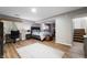 Finished basement features bedroom area, desk, and stairs at 7831 Eagle Valley Pass, Indianapolis, IN 46214
