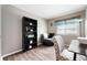 Bedroom features a chair, bookshelf, desk, and window at 7831 Eagle Valley Pass, Indianapolis, IN 46214