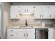 Updated kitchen featuring white cabinets, stainless steel appliances, granite countertops and modern fixtures at 7831 Eagle Valley Pass, Indianapolis, IN 46214