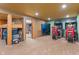 Finished basement with arcade games, ping pong table, sleeping area and fitness room in the background at 7978 Park Meadows Dr, Brownsburg, IN 46112