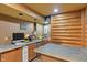 The basement features a small wet bar, a wood paneled accent wall, sports memorabilia and room to eat at 7978 Park Meadows Dr, Brownsburg, IN 46112
