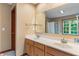 Bathroom with a double sink vanity, large mirror, and plenty of counter space at 7978 Park Meadows Dr, Brownsburg, IN 46112