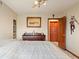 A comfortable bedroom featuring college sports decor and a charming, rustic wooden dresser at 7978 Park Meadows Dr, Brownsburg, IN 46112