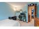 Bedroom featuring desk with computer, shelves of trophies, and view into another bedroom at 7978 Park Meadows Dr, Brownsburg, IN 46112