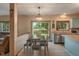 Light-filled dining area with table, chairs, and sliding glass doors to the backyard at 7978 Park Meadows Dr, Brownsburg, IN 46112