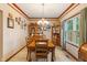 Elegant dining room with wood table, chandelier, and decorative accents at 7978 Park Meadows Dr, Brownsburg, IN 46112