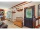 Inviting entryway with wood floors, decorative shelves, and a charming bench at 7978 Park Meadows Dr, Brownsburg, IN 46112