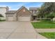 Charming two-story home featuring a brick facade, three-car garage, and manicured lawn at 7978 Park Meadows Dr, Brownsburg, IN 46112