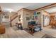 Spacious living room with wood floors, staircase, and a comfortable seating area at 7978 Park Meadows Dr, Brownsburg, IN 46112
