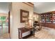 Bright living room featuring wood floors, mirror, and ample natural light at 7978 Park Meadows Dr, Brownsburg, IN 46112