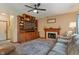 Cozy living room boasts a fireplace, built-in shelving, and comfortable seating at 7978 Park Meadows Dr, Brownsburg, IN 46112
