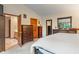 Neutral main bedroom with dark wood furniture, large mirror, and ensuite access at 7978 Park Meadows Dr, Brownsburg, IN 46112