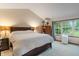 Spacious main bedroom with natural light from large window and neutral carpeting at 7978 Park Meadows Dr, Brownsburg, IN 46112