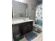 Bathroom featuring a vanity with a sink, toilet, and shower with a decorative shower curtain at 8241 Morera Ct, Indianapolis, IN 46237