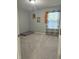 A simple bedroom with neutral walls and carpet features a twin bed and window at 8241 Morera Ct, Indianapolis, IN 46237