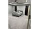 The spacious bedroom features a patterned bed, neutral walls, and ample carpeted floor space at 8241 Morera Ct, Indianapolis, IN 46237