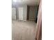 A large bedroom features carpeted floors, neutral walls, and two entry doors at 8241 Morera Ct, Indianapolis, IN 46237