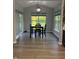 Bright dining area with modern light fixture and views of backyard at 8241 Morera Ct, Indianapolis, IN 46237