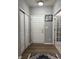Inviting entryway featuring wood-look flooring, neutral paint and ample closet space at 8241 Morera Ct, Indianapolis, IN 46237