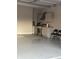 The garage includes a functional kitchenette with stainless steel appliances and modern cabinets at 8241 Morera Ct, Indianapolis, IN 46237
