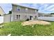 A spacious backyard features a patio, well-maintained lawn and vinyl siding, providing an outdoor retreat for relaxation at 8325 Chesterhill Ln, Indianapolis, IN 46239