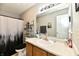 Well-lit bathroom with a spacious vanity and shower-tub combo, ideal for comfort at 8325 Chesterhill Ln, Indianapolis, IN 46239