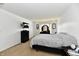 Neutral Primary bedroom featuring carpet, mounted tv, a dark dresser, and modern furnishings at 8325 Chesterhill Ln, Indianapolis, IN 46239