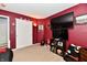 The red bedroom has Florida State Seminoles decor, two TVs and closet at 8325 Chesterhill Ln, Indianapolis, IN 46239