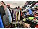 Walk-in closet featuring metal shelving containing clothes, shoes, and other personal items at 8325 Chesterhill Ln, Indianapolis, IN 46239