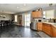 Open floor plan features the dining area, kitchen, and sliding glass door to the backyard at 8325 Chesterhill Ln, Indianapolis, IN 46239