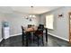 Cozy dining area with overhead lighting, convenient water cooler, and views of the backyard at 8325 Chesterhill Ln, Indianapolis, IN 46239