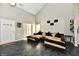 Bright living room with large windows, cozy seating, and a glimpse of the staircase and front entrance at 8325 Chesterhill Ln, Indianapolis, IN 46239