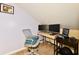 This home office features two monitors, a laptop, and a gray chair at 8325 Chesterhill Ln, Indianapolis, IN 46239