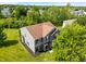 Aerial view showcasing the home's roof, siding, yard, and mature trees providing shade and privacy at 8631 Belle Union Pl, Indianapolis, IN 46113