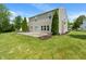 A view of the home's backyard featuring a deck, siding, well manicured lawn and lovely landscaping with mature trees at 8631 Belle Union Pl, Indianapolis, IN 46113