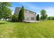 The expansive backyard with large lawn, offers a tranquil outdoor space perfect for relaxing and entertaining guests at 8631 Belle Union Pl, Indianapolis, IN 46113