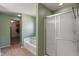 Elegant bathroom with shower stall, tub, and tile floors at 8631 Belle Union Pl, Indianapolis, IN 46113